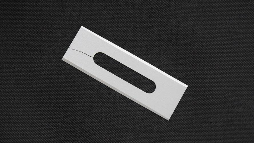 A chipped ceramic blade next to an intact one