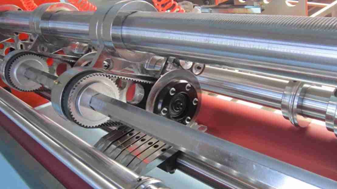 A close-up of a precision industrial blade cutting through material