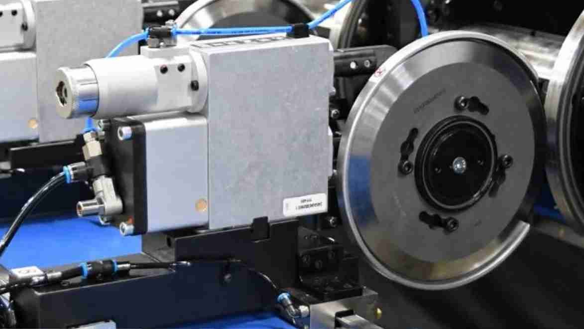 A machine performing an automated non-destructive test on industrial blades