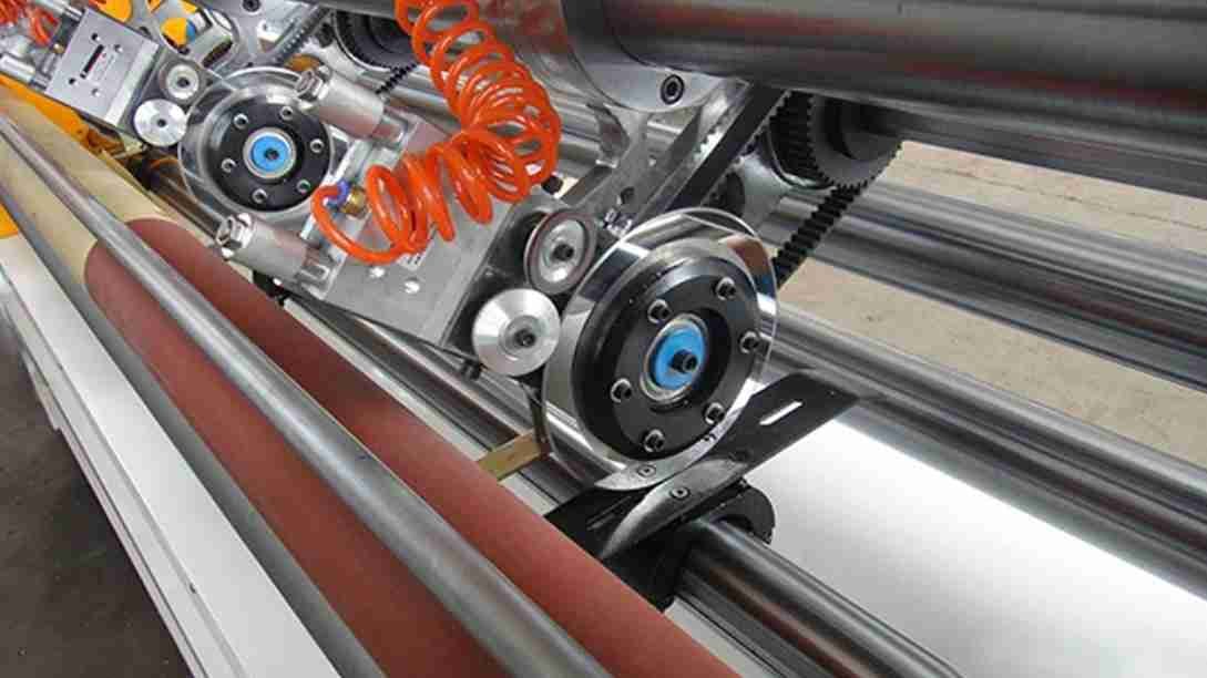 A stainless steel blade being installed in a clean, hygienic food processing facility