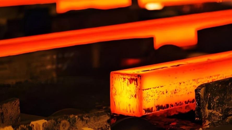 A glowing red-hot blade undergoing heat treatment in a furnace