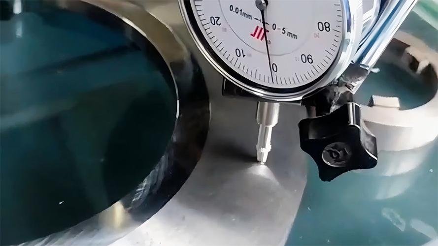 A digital measuring tool showing a tight tolerance reading on a blade surface