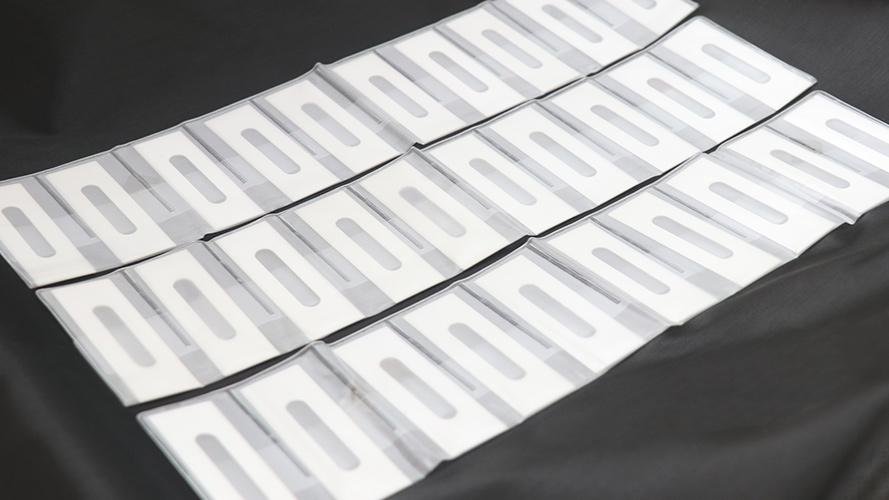 Ceramic blade cleanly slitting a roll of plastic film