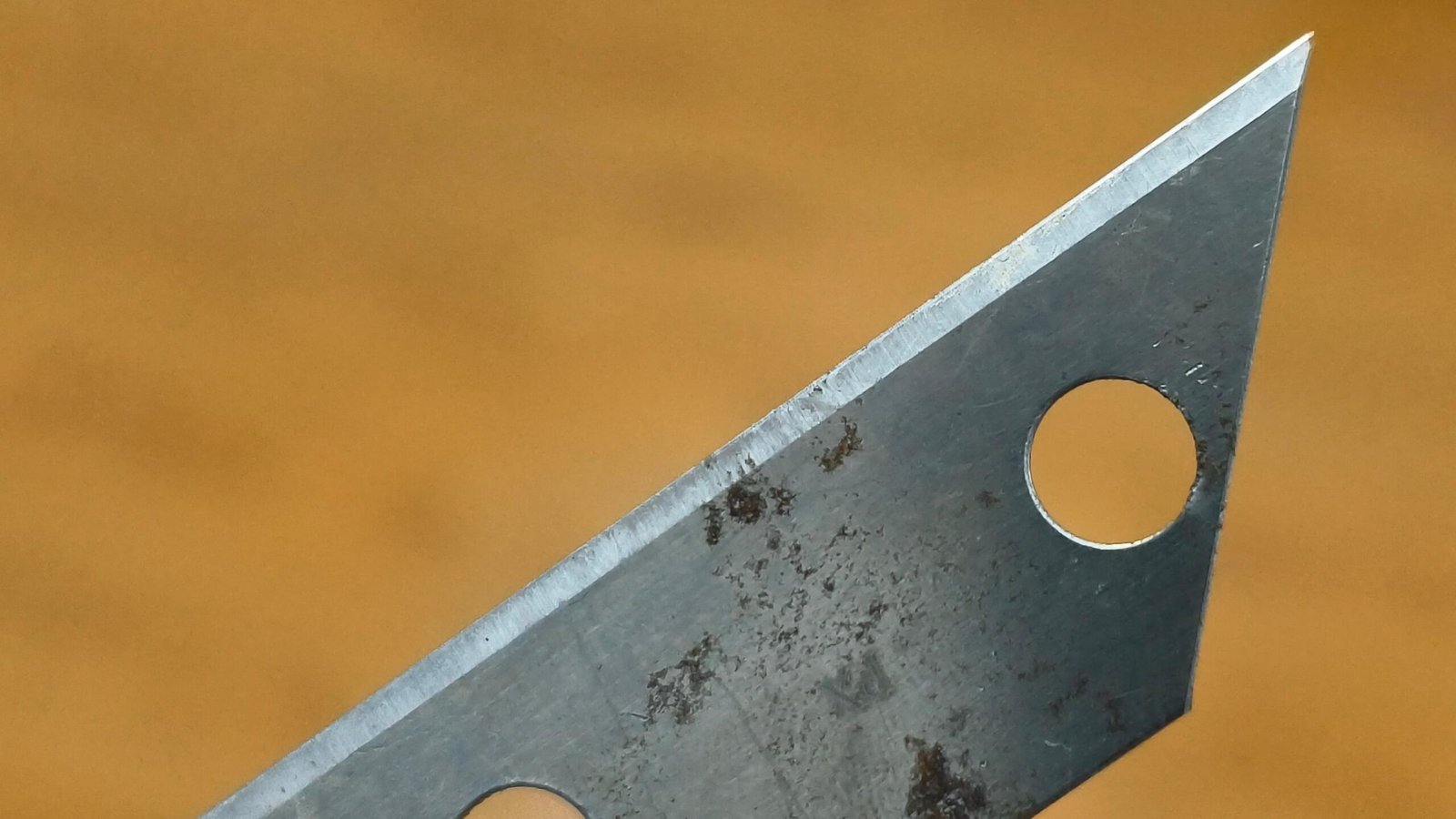 Chipped edge of a carbide blade after machining hardened steel