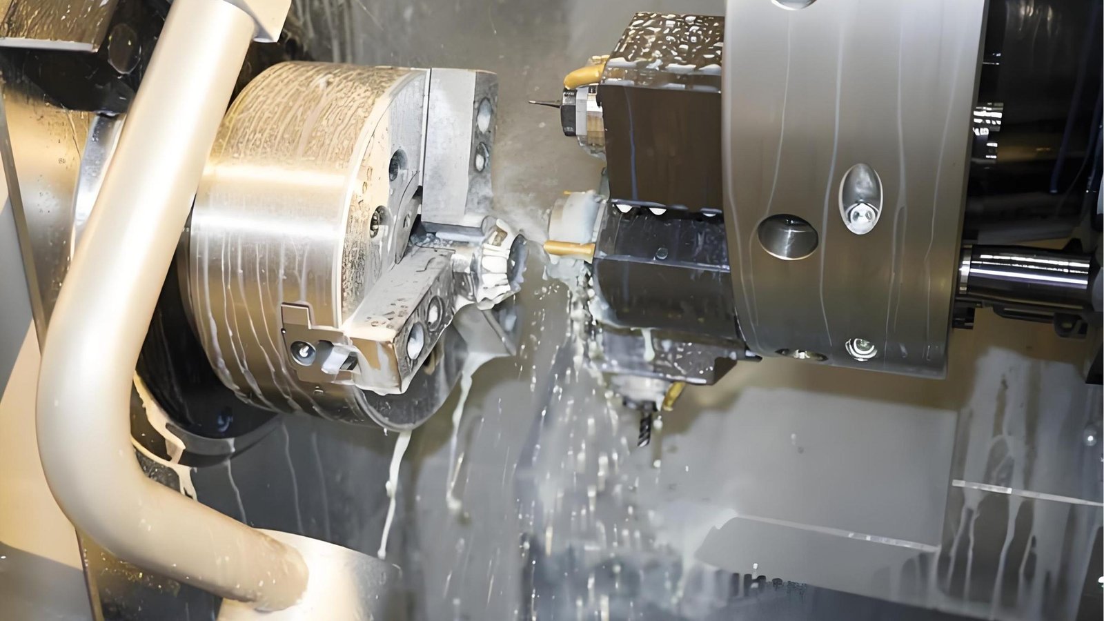 CNC machine in operation with coolant spray