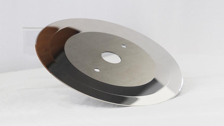 A precision-ground thin-section blade made from PM steel