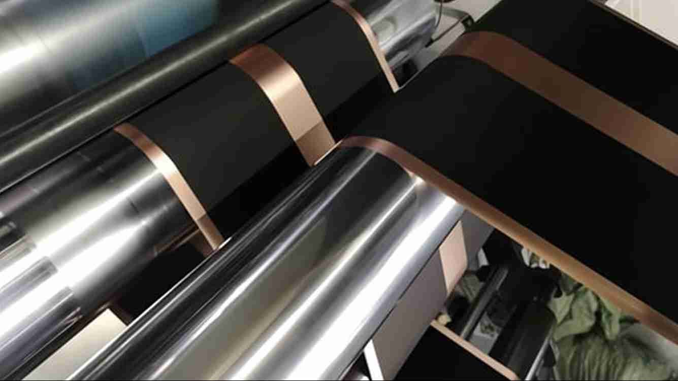 Detailed view of a blade cutting a battery electrode sheet