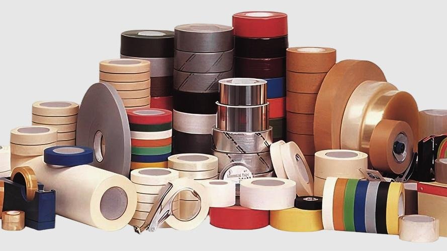 An assortment of different industrial tapes on a workbench