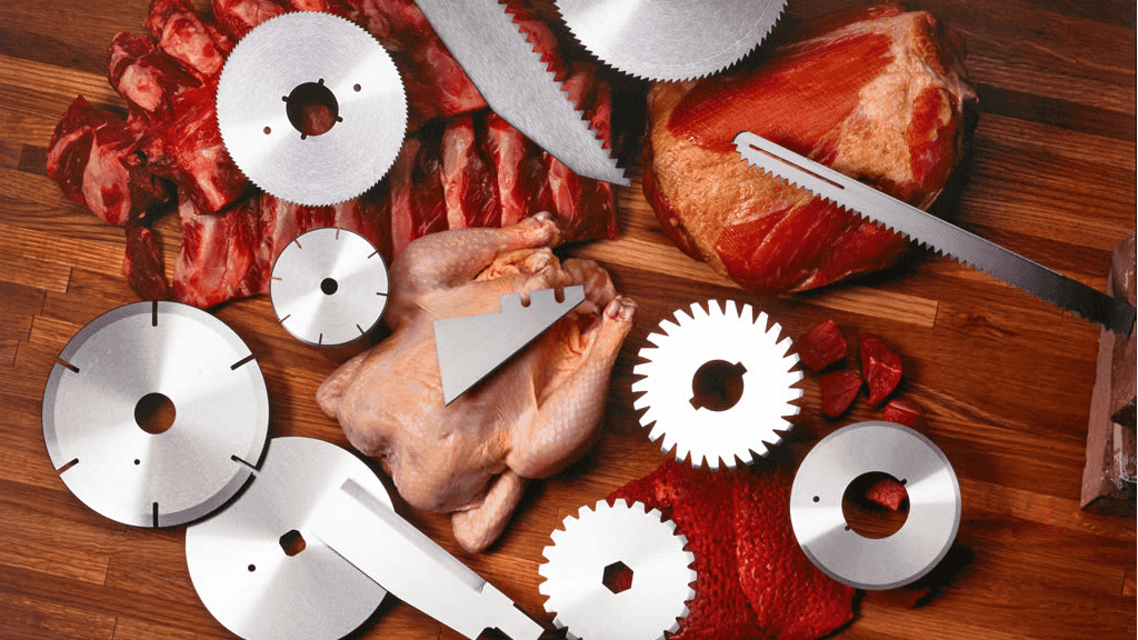 A sharp industrial blade cleanly slicing through vegetables