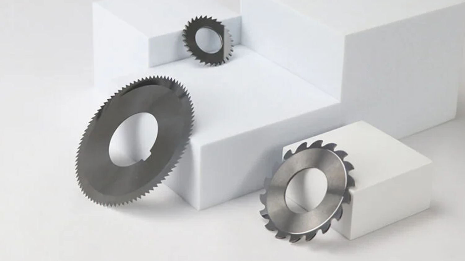 Technician examining an industrial blade against a specific material