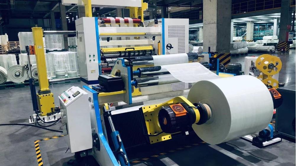 A sharp PCD blade cutting through a sheet of glass-fiber-reinforced plastic cleanly.