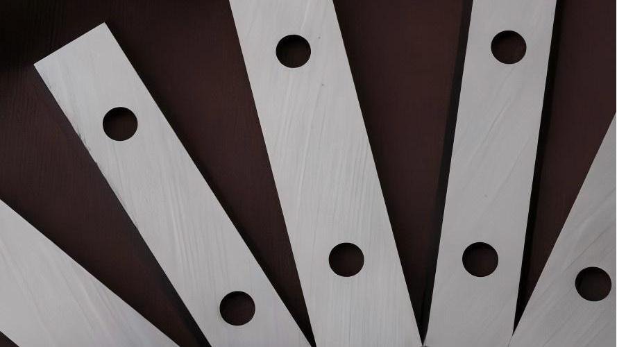 A close-up shot of a high-performance PM steel industrial blade