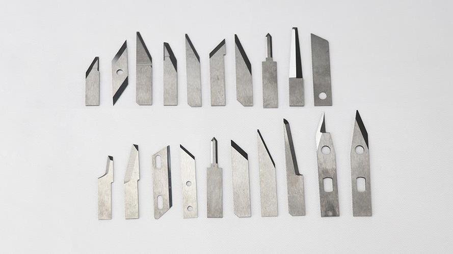 Two people shaking hands in front of factory machinery