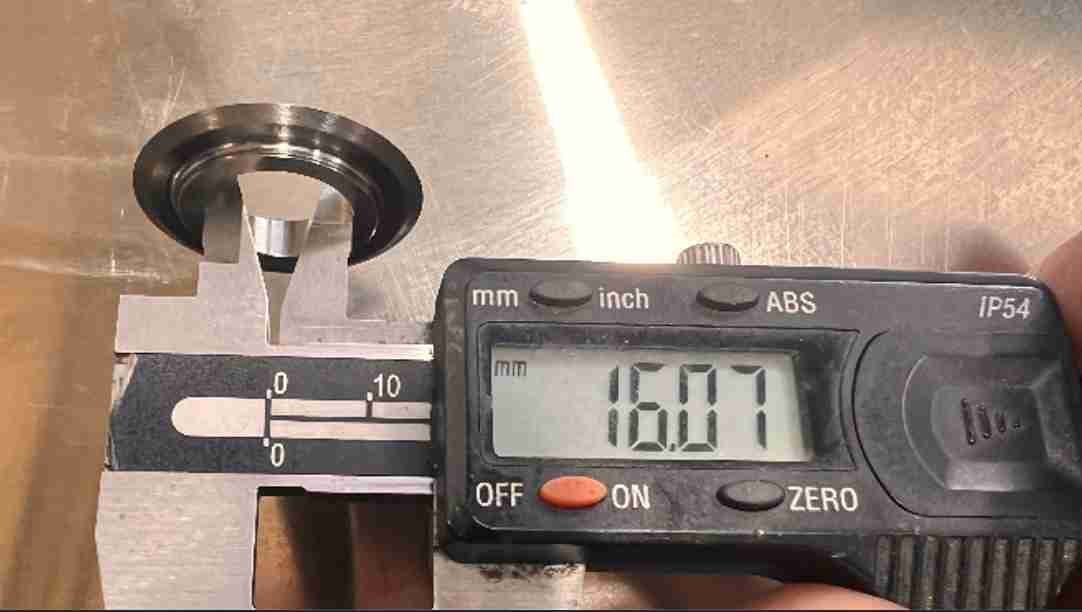 A close-up of an industrial bearing on a cutting machine shaft