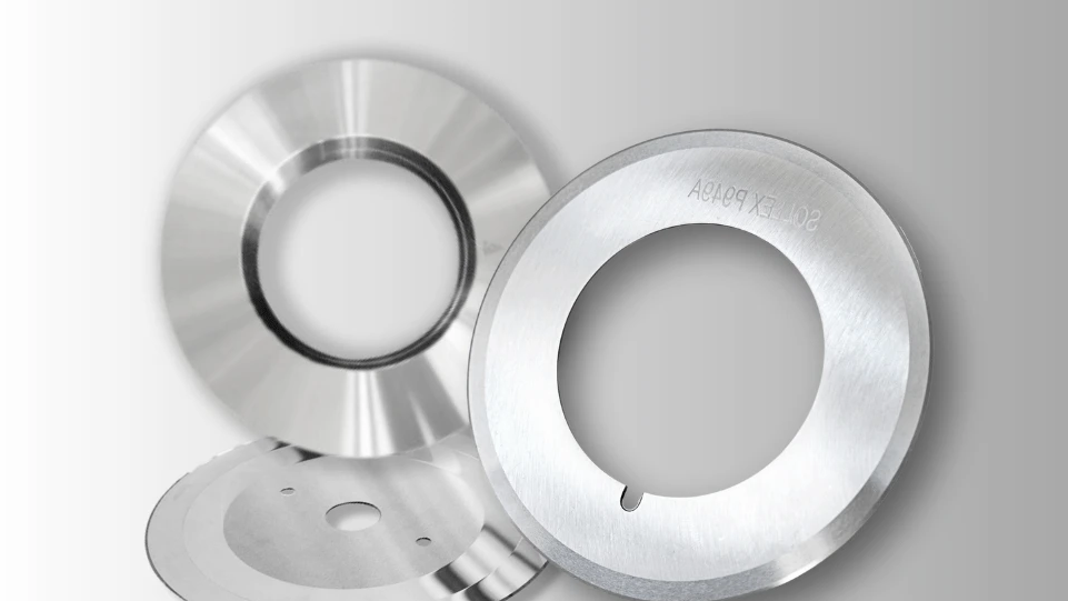 A close-up shot of industrial blades with varying surface finishes, from matte to mirror-polish