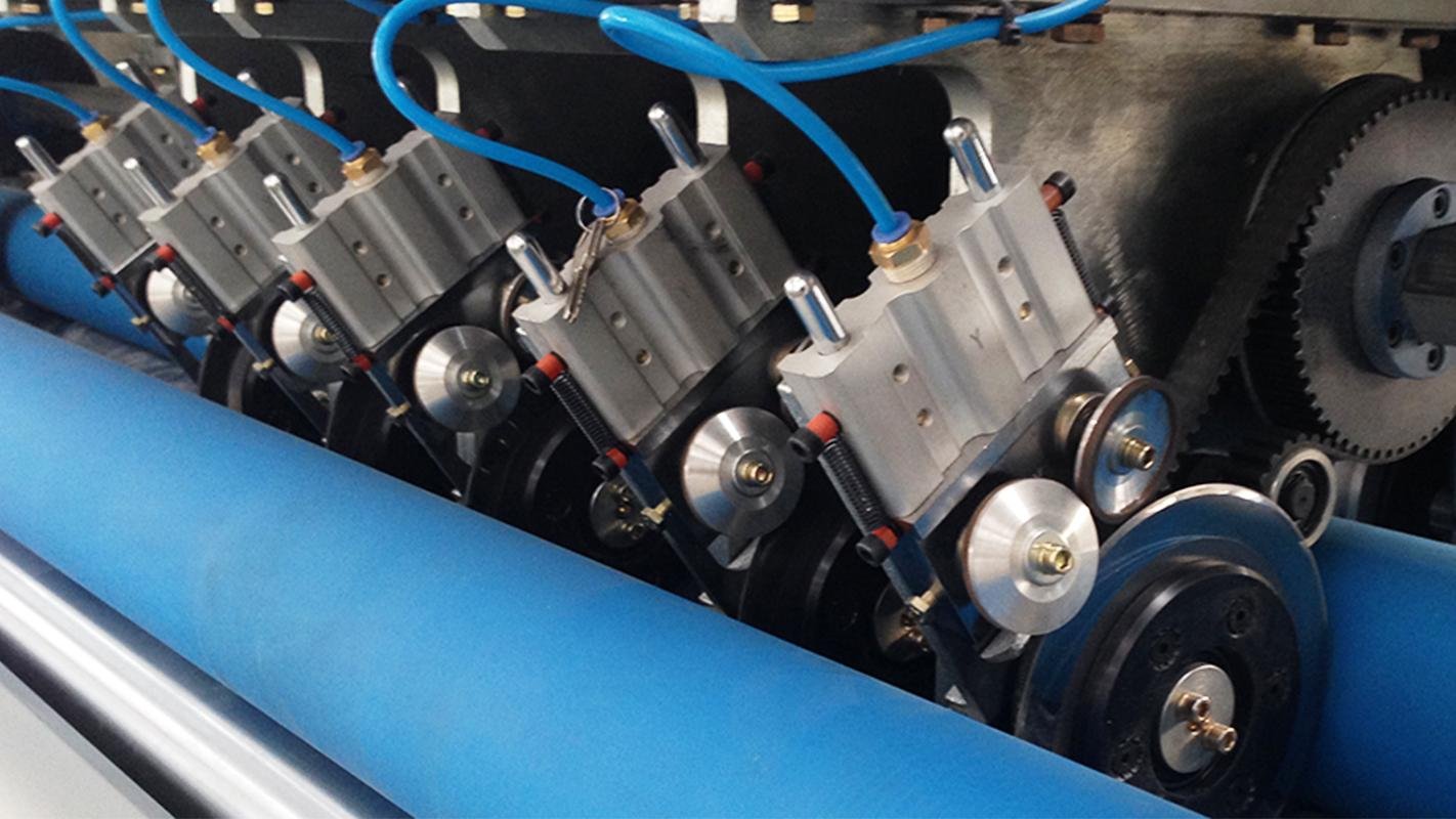 A CNC machine grinding a tungsten carbide blade to high precision