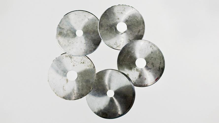 Industrial blades showing different levels of wear and tear