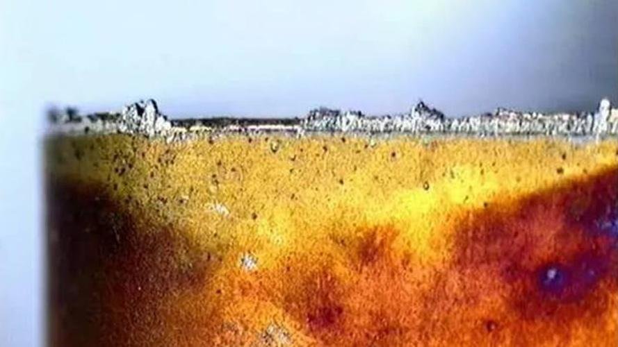 A close-up of a cutting blade with Built-Up Edge visible