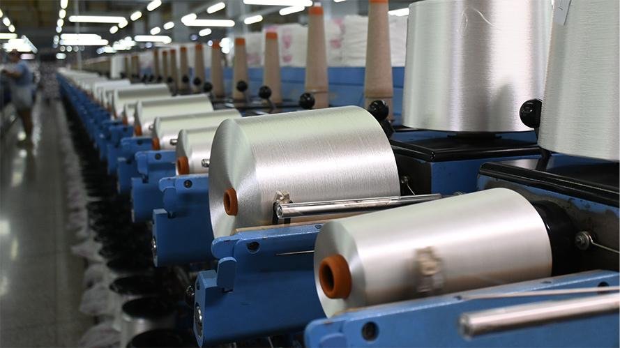 A split image showing a food processing line and a textile manufacturing line