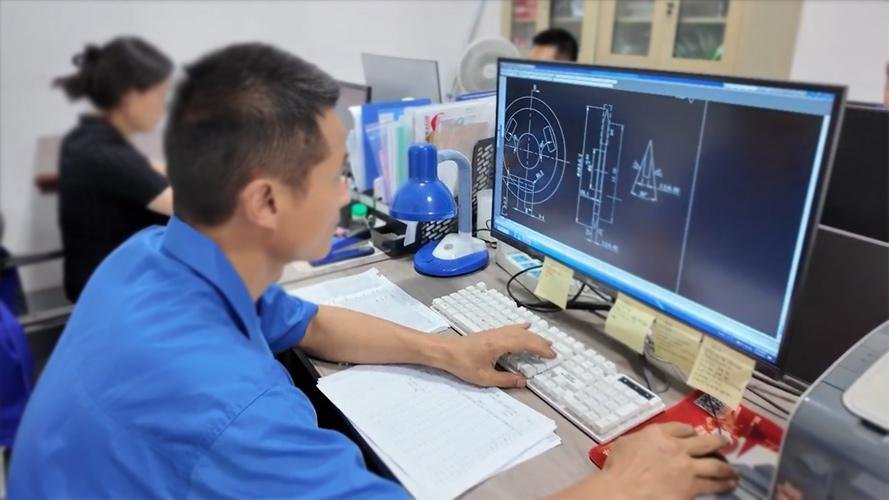An engineer designing a custom industrial blade on a computer