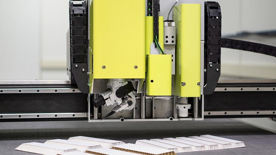 A close-up of a tungsten carbide blade effortlessly cutting through an abrasive material