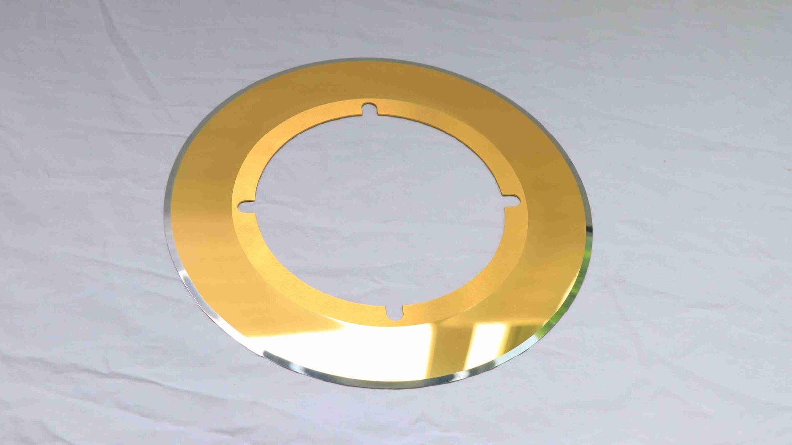 A close-up of a gold-colored TiN coated tungsten carbide blade