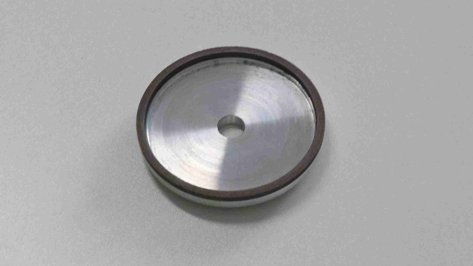 A PASSION sales manager discussing a blade with a client in a workshop