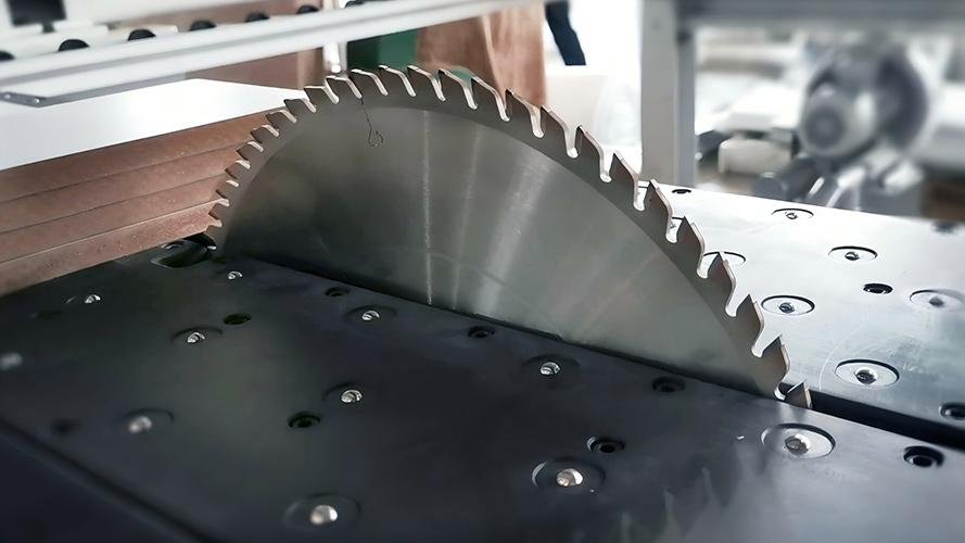 An industrial saw cutting through high-density fiberboard.