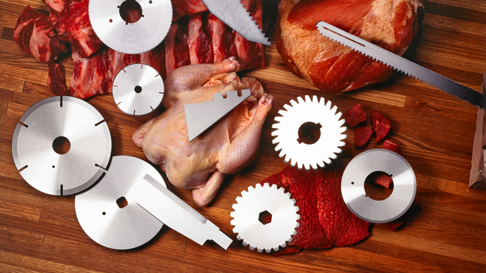 Industrial meat slicer blades on a workbench