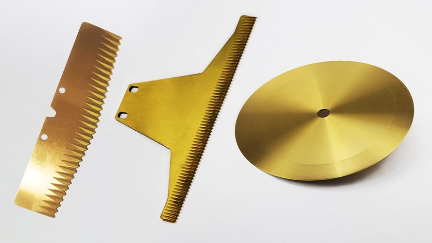 A close-up of a gleaming, PVD-coated industrial blade with a perfect edge