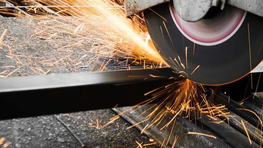 A precision cut on an aluminum window frame showing a mirror-like finish.