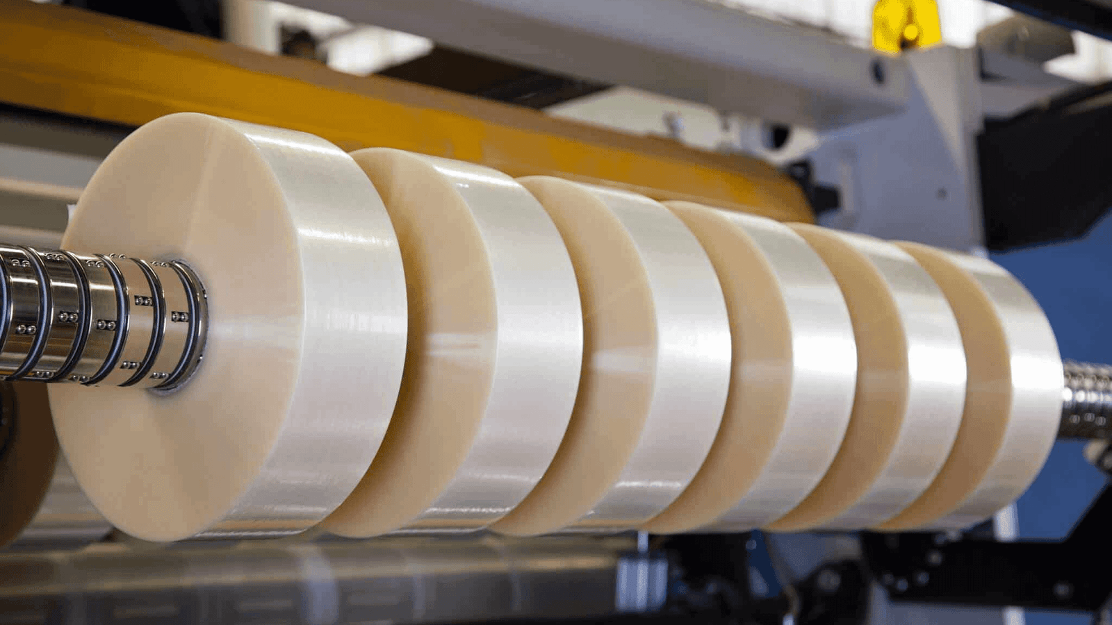 A serrated blade cutting through a thick piece of rubber.