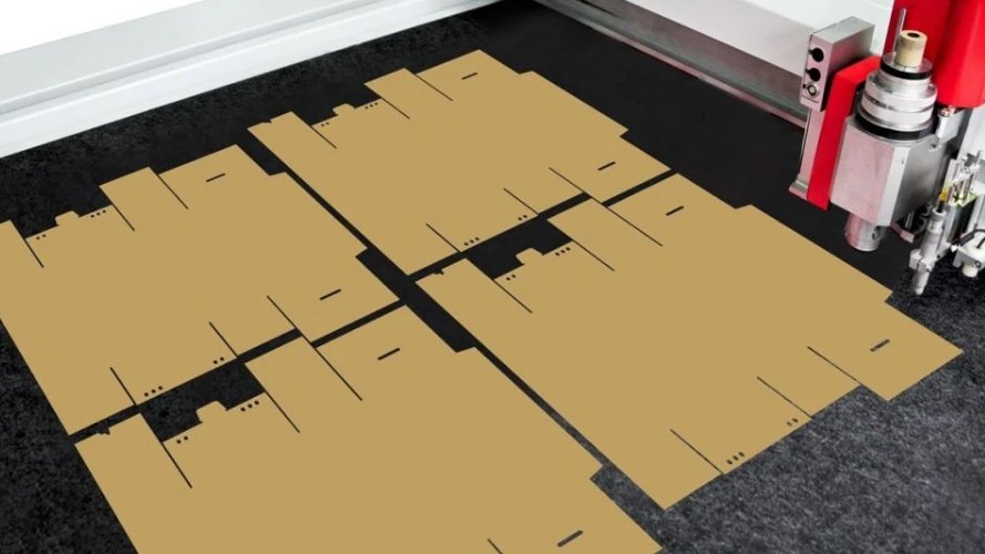 An oscillating blade cutting cardboard