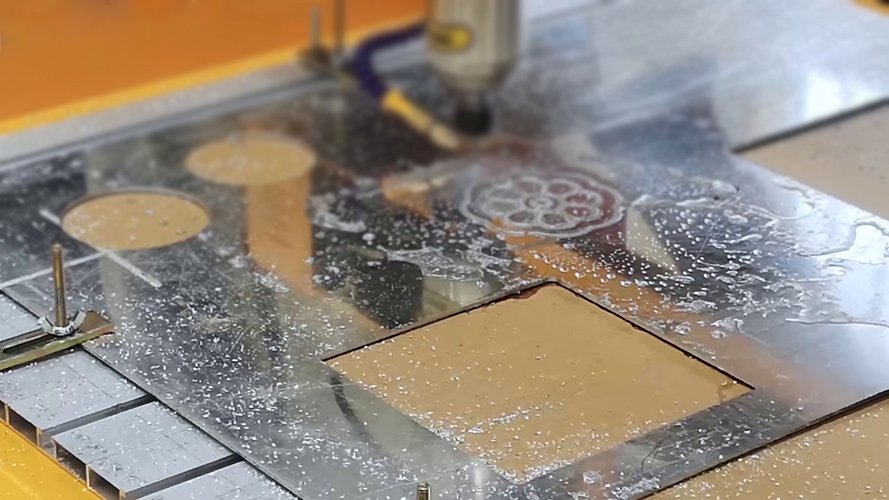 A close-up of a CNC machine cutting a piece of metal