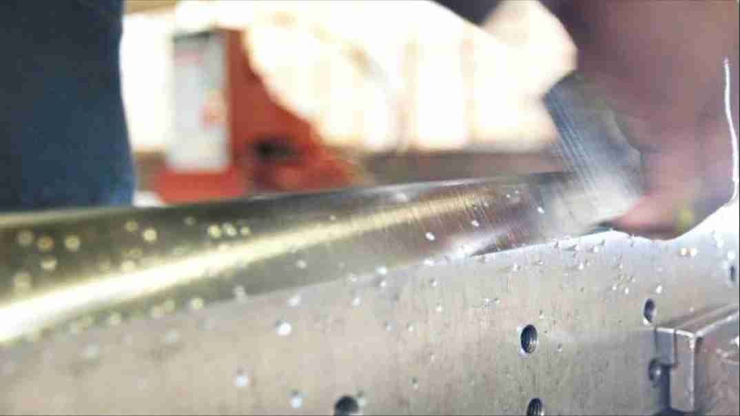 sharpening an industrial blade with controlled pressure